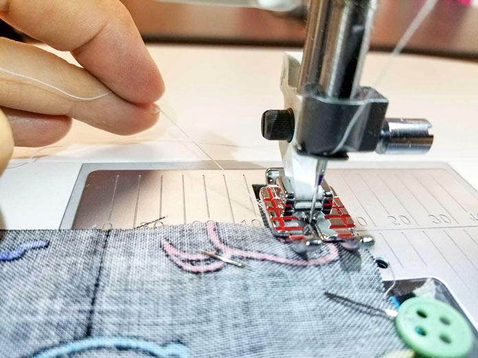 Hold the threads when you're starting a new line of stitching