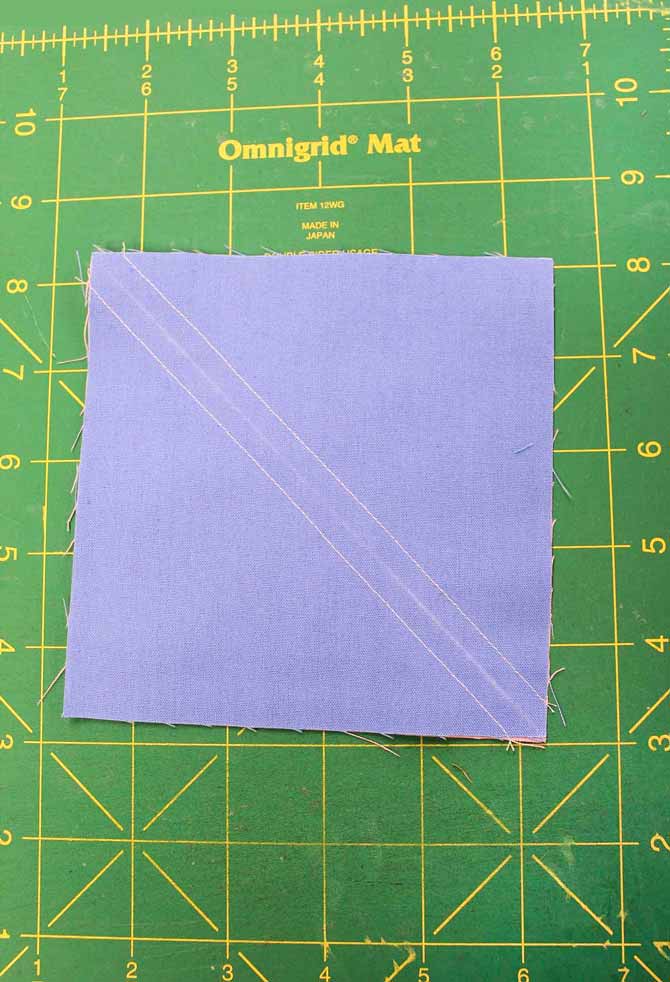 Draw a diagonal line and stitch a scant ¼ʺ on either side.