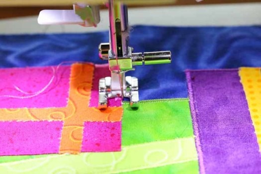 Stitch the applique from the bottom layers to the top layers