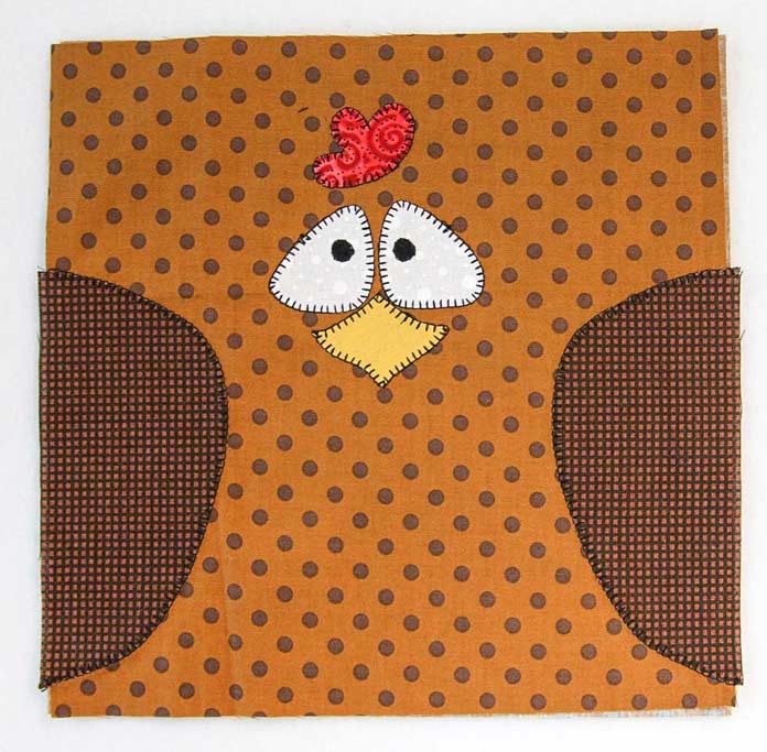 The blanket stitching is complete on the chicken pot holder