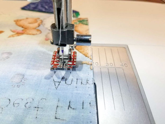 Using the lines on the stitch plate as a guide to sew a wider seam
