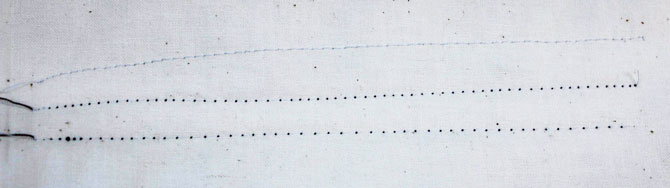 Three lines of stitching to test various thread tension settings