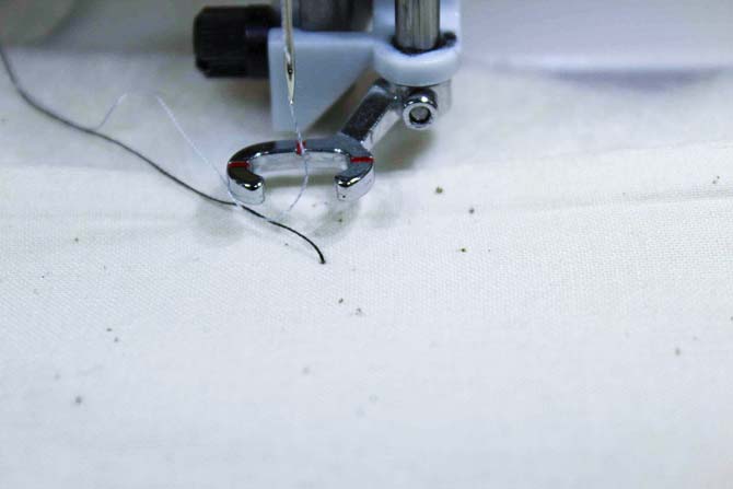 Bobbin thread is pulled to the top of my quilt to prevent thread nests on the underside of the work