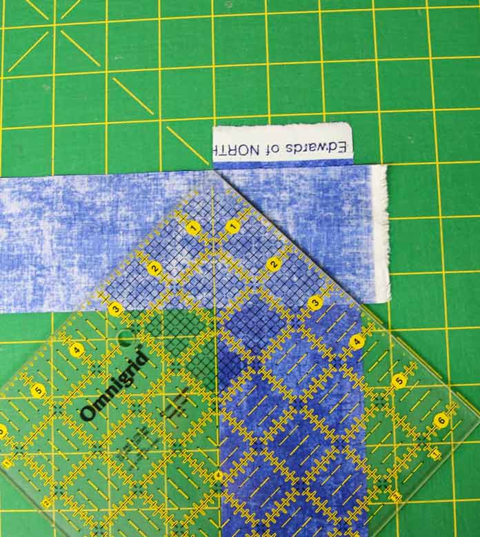 Using a square ruler to help join the binding strips