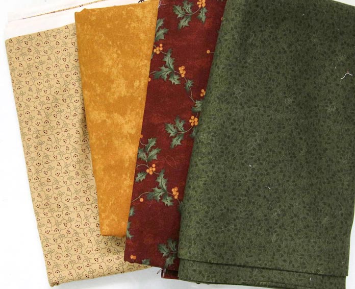 Four different fabrics that could work for the sashing.