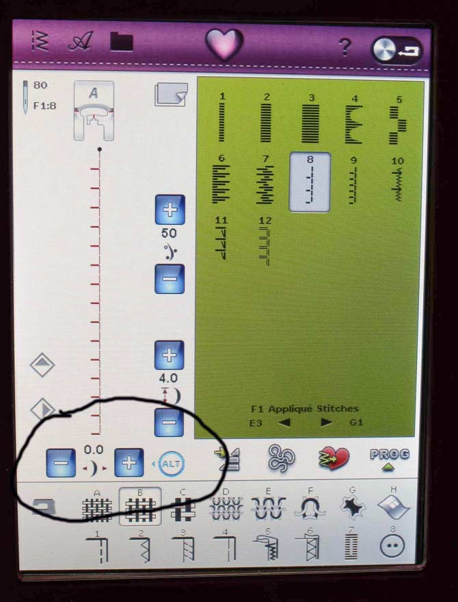 The +/- signs to adjust the stitch positioning to the left or right of the center needle position