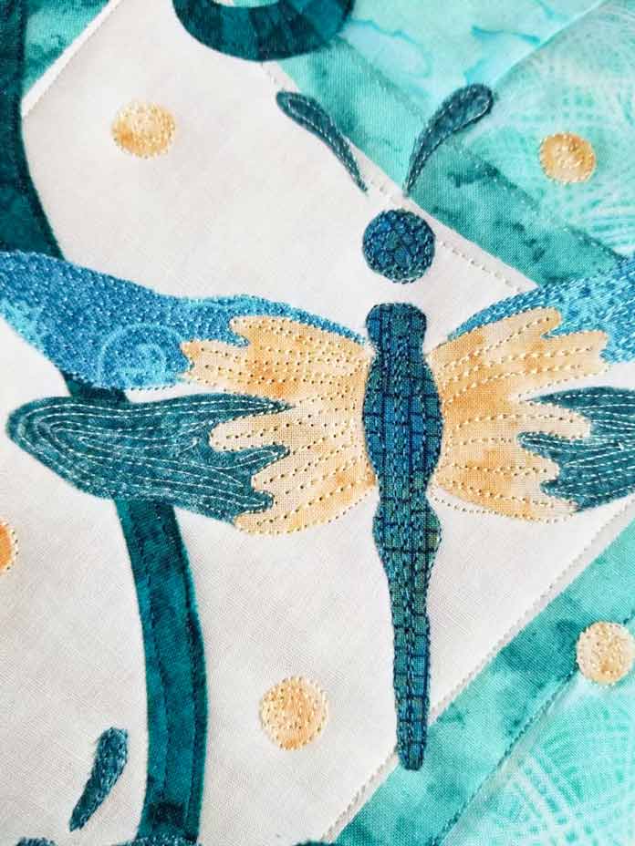 The dragonfly is completely stitched.