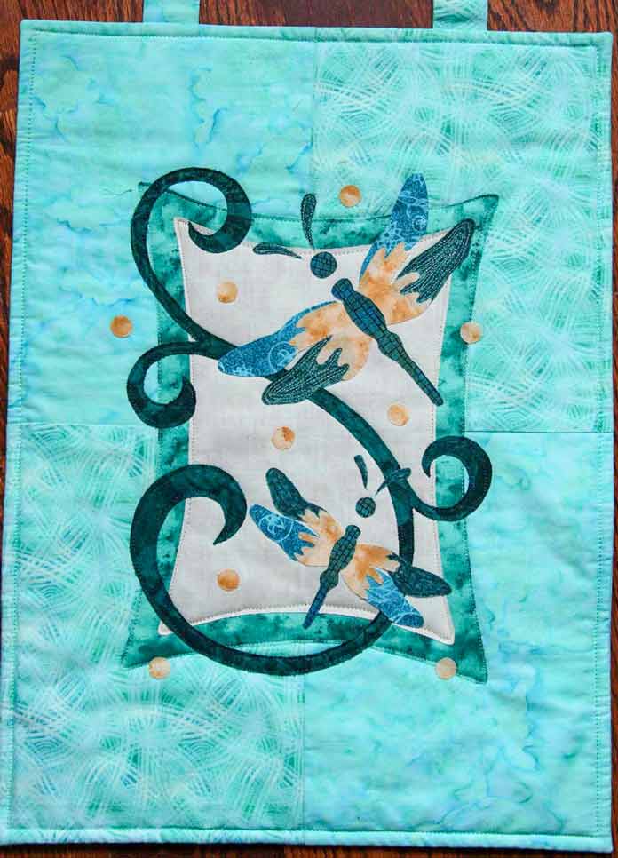A half quilted raw-edged applique wallhanging