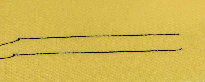 The top line of stitching was done with the single hole throat plate while the bottom one was done with the multi-purpose throat plate.