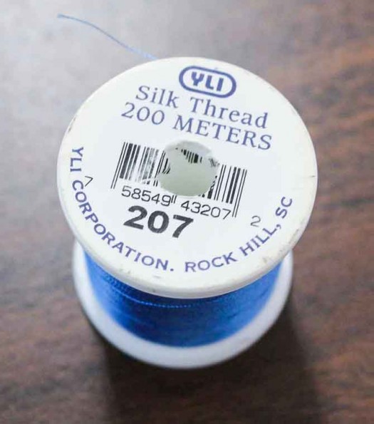 Make sure the label is tucked into the spool