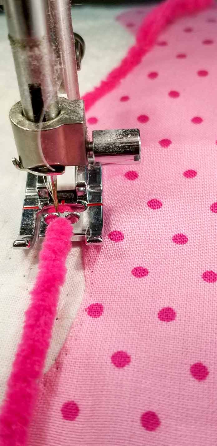 Couching the yarn to the applique block using the Three-Hole Yarn Foot and the HUSQVARNA VIKING Designer Brilliance 80 sewing machine