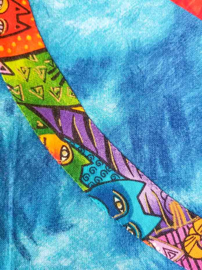 Invisible machine applique using an elongated zigzag stitch with invisible thread