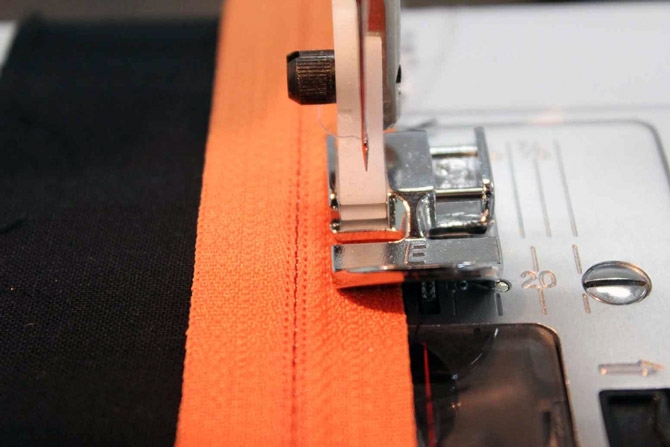 You can sew one side of the zipper on - see how the Zipper Foot E follows along on the zipper tape, while the foot does not come anywhere near the zipper teeth.