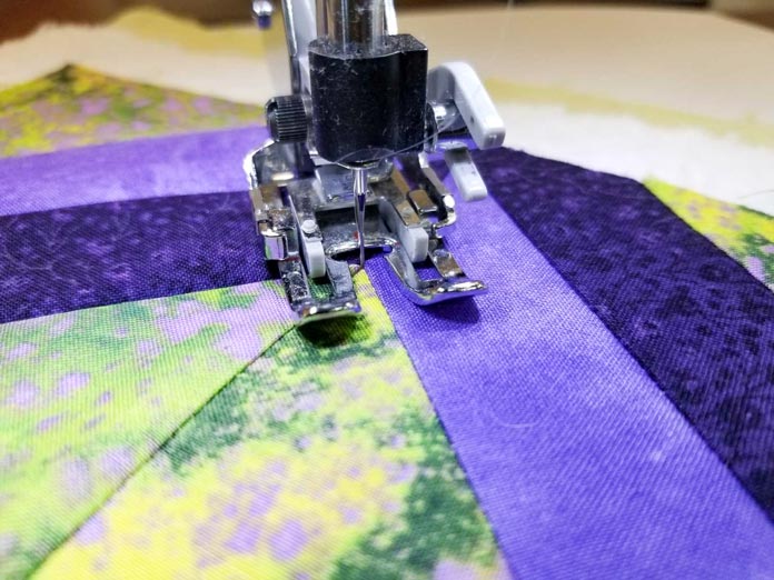 Using the Needle Stop Up/Down feature when quilting makes it easy to get perfect corners for stitch in the ditch quilting
