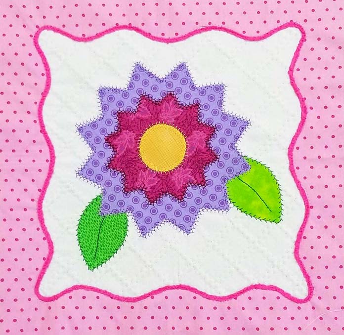 A floral applique block using decorative stitches for the applique on the HUSQVARNA VIKING Designer Brilliance 80 sewing machine