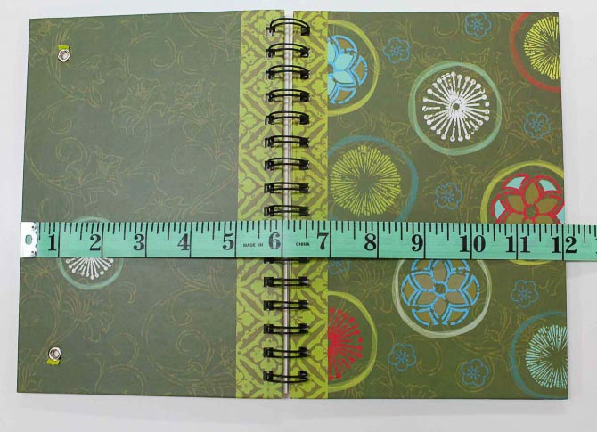 Now measure your journal. DO NOT measure the journal like this. Note the number on the measuring tape - 12 inches. However look what happens when we close the journal.