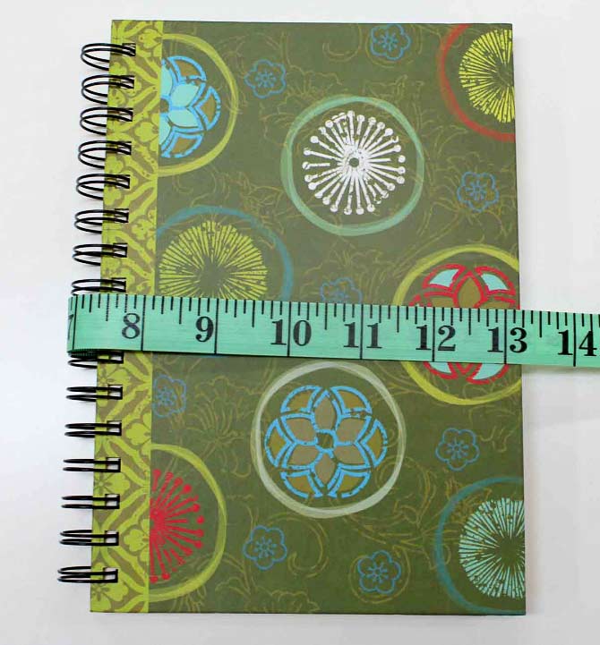 YES - do you see? The measurement is now 1 and 1/4" LONGER than it was when the journal was open. It's VERY important that you use a tape measure to measure the width of the piece required for the outer part of the journal cover and measure the journal when it's CLOSED.