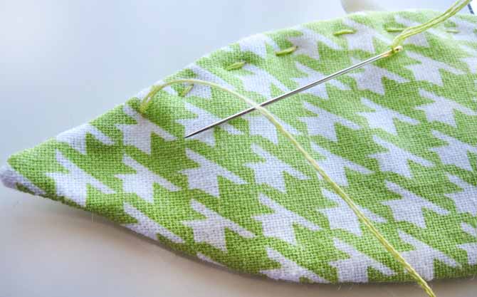 A bit of hand quilting using embroidery floss on the leaves creates texture and interest.