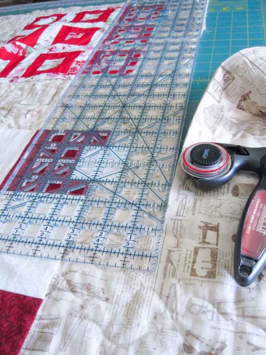 Trim up the top, bottom and sides of the quilted throw.