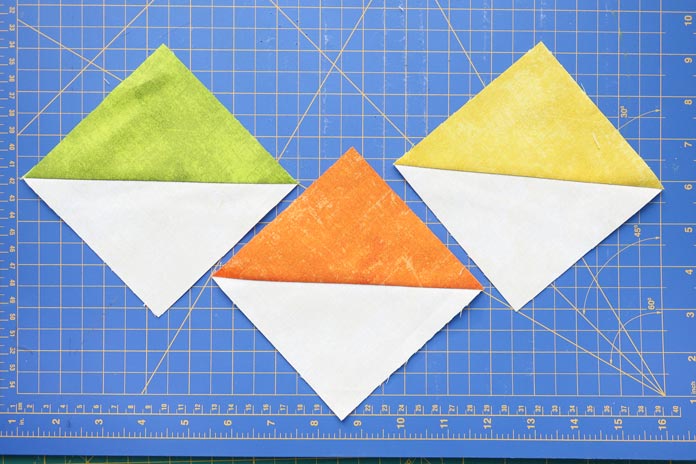 Half square triangle blocks made using Northcott Canvas fabrics.