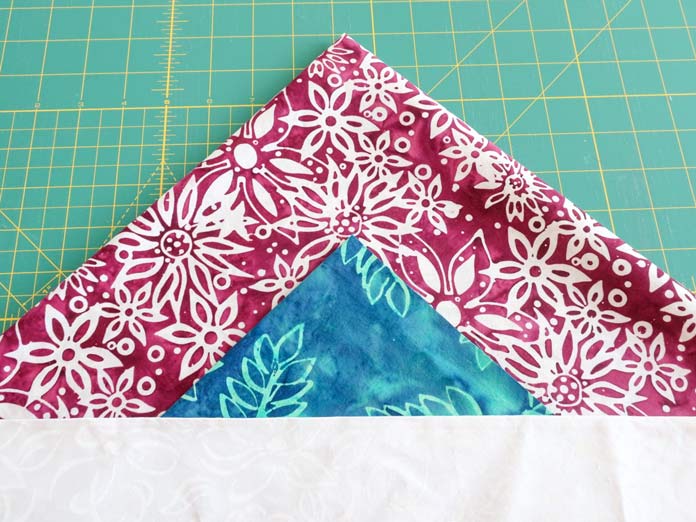 These Aqua and Berry fabrics with the White on White on white make a great combo for Half Square triangles.