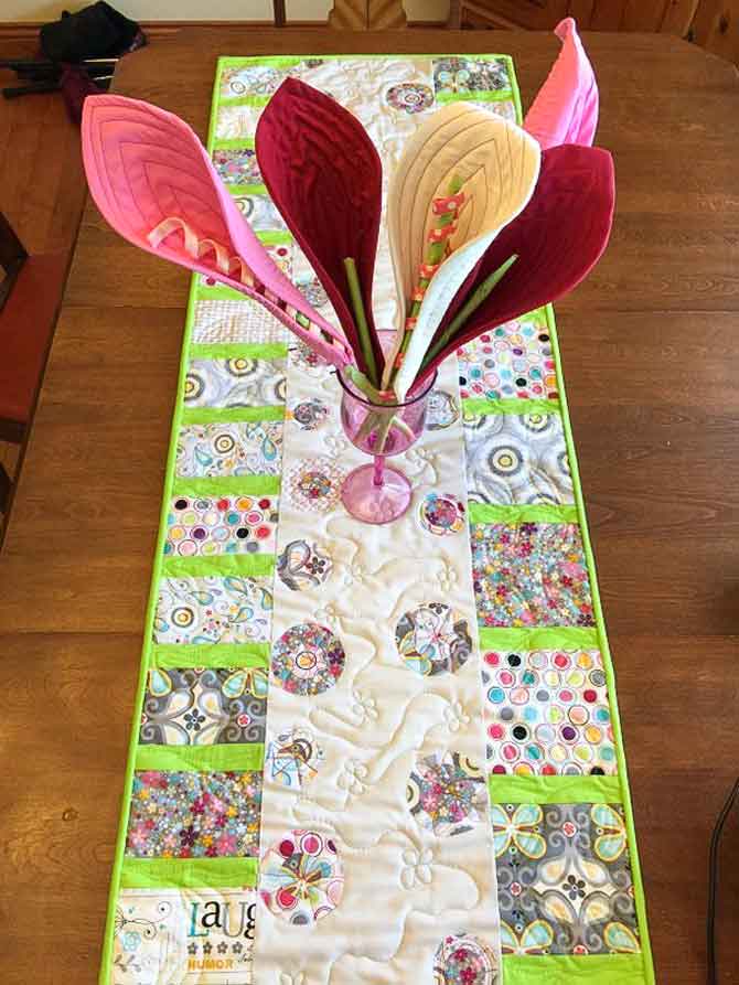 Free motion quilted flower table runner