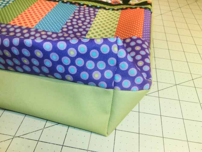 Bottom of the tote is shown with nice professional looking boxed corners. Northcott.