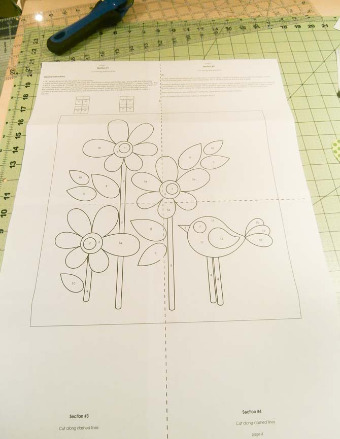 Applique design sections are taped together to complete the 12" applique design template