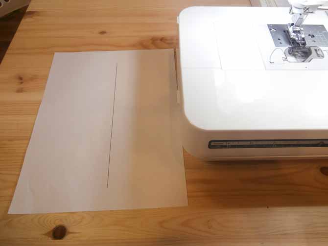 Draw a straight line in the center of a regular piece of printer paper