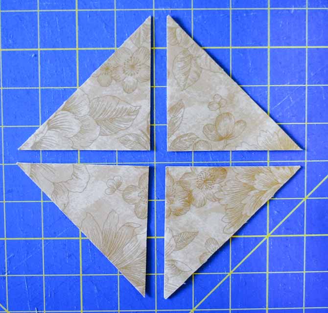 Here is the 5" square cut in half diagonally twice to make the large setting triangles
