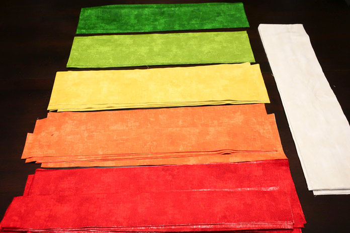 Fabrics strips are cut and ready to be sub-cut.