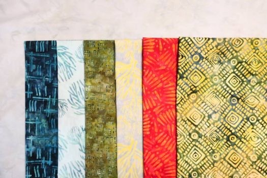 6 fabrics from the Nostalgic Vibes collection used to make this week's quilt.