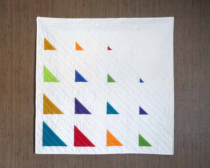 The modern half square triangle quilt is completed.