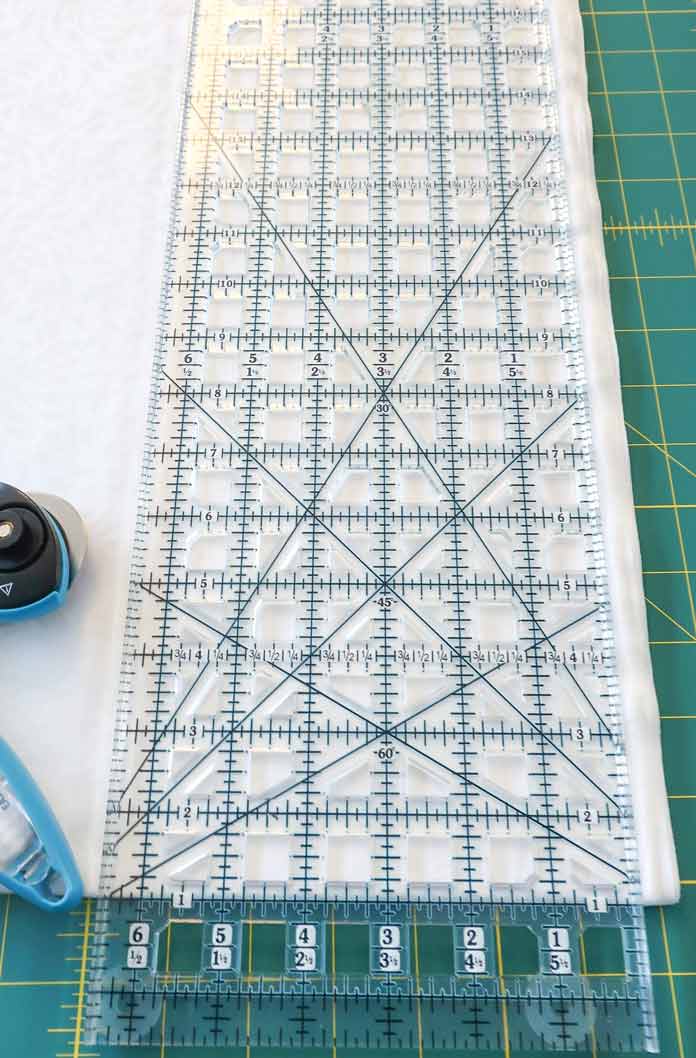 Align the TrueCut ruler to the edge of the fabric.
