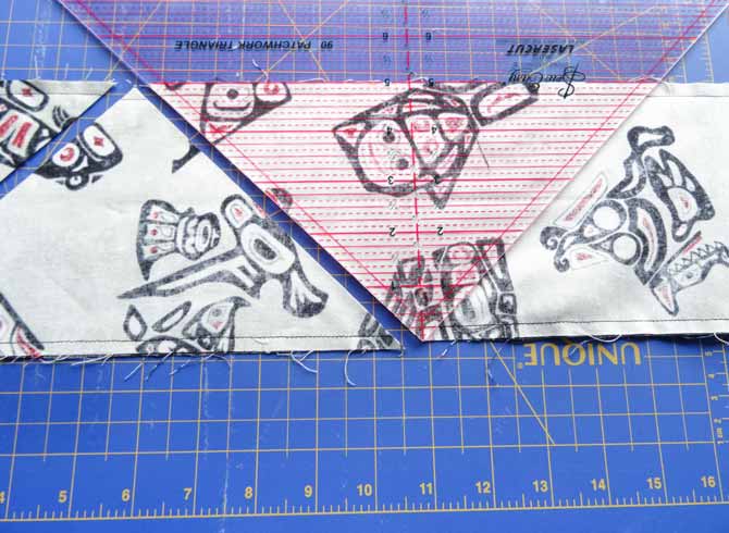 Rotate the ruler and align the 5" line with the other edge of the fabric.