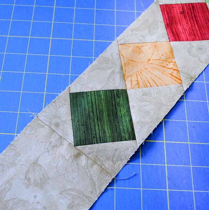 The 4" wide fabric strips are sewn to the end of the pieced border section