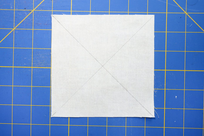 Make diagonal lines on the back of every piece of fabric from Pile 1.