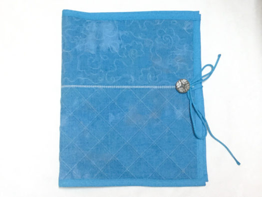 Needle organizer constructed and decorated with SCHMETZ twin needles.