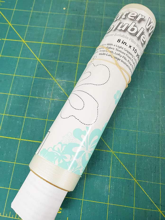 A roll of Inspira Water Works Soluble Film stabilizer with the label and instructions included