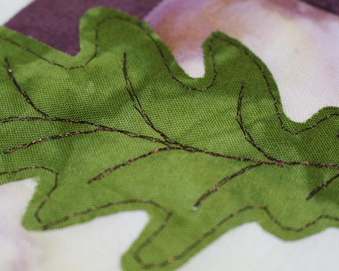 Stitched leaf applique using WonderFil's metallic Spotlite #8839 Nutty Brown color