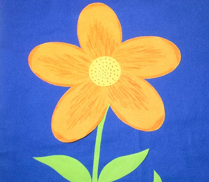 A large playful flower accented with Fabric Fun Markers is the focal point of our quilted spring banner