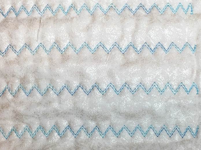 A three step zig zag stitched with a 1.6 twin needle