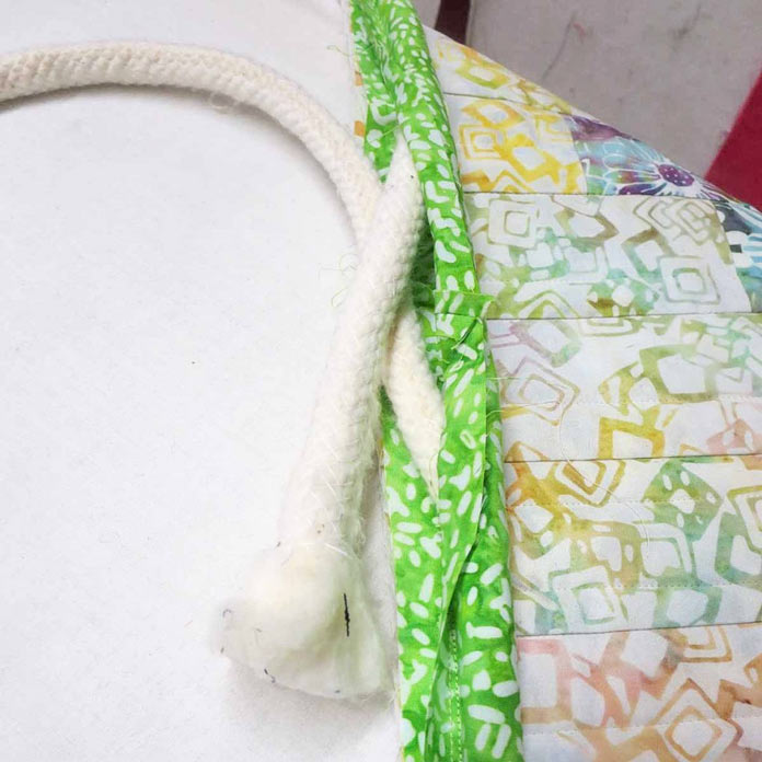 Sew ends of cording fabric together.