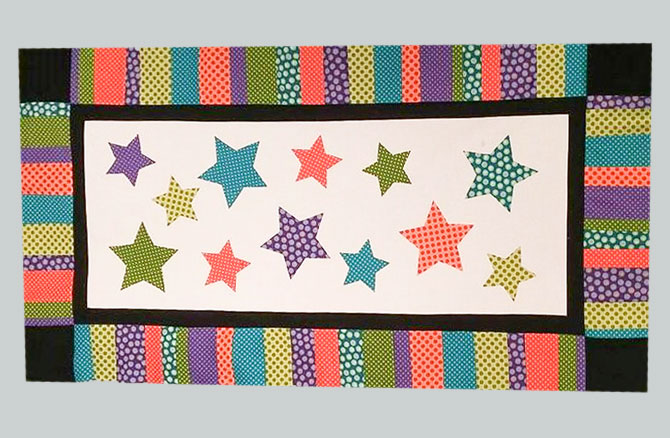 With the table topper now complete, Bill's All Stars project is ready to have the stars machine appliqued and the table topper quilted so I can show off these stunning prints and colors from Northcott Fabrics Urban Elementz Basix Collection.