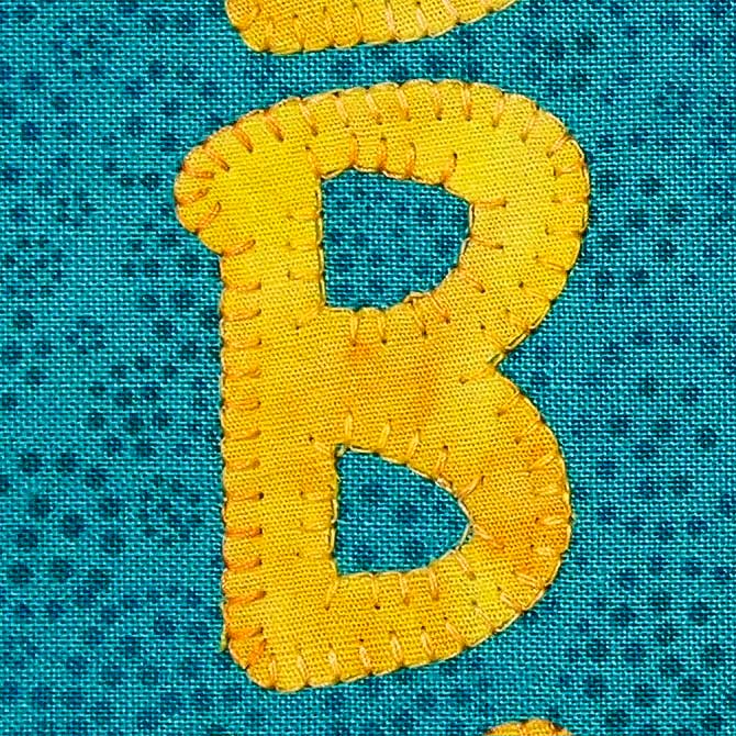Blanket stitch around the letter B