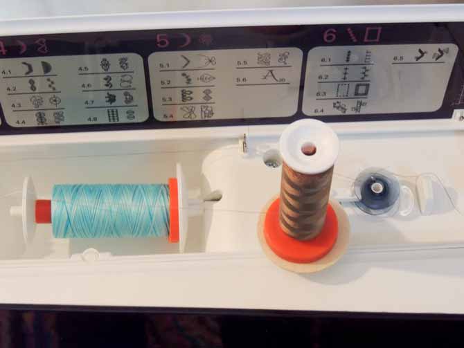 Winding bobbin with second spool of thread