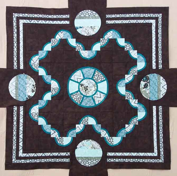Borders on the quilt - just need to outline the circles in dark teal