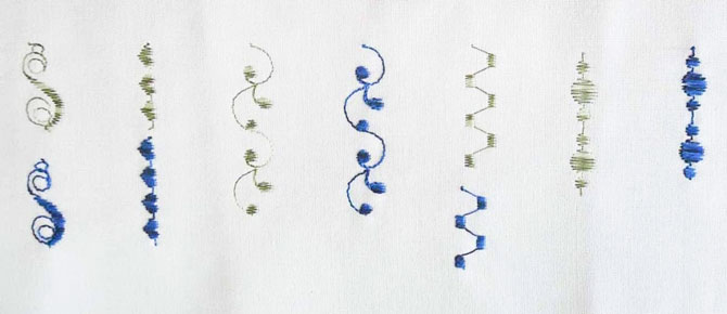 A sampler of a few of the satin stitch designs available on the Brother NQ900, stitched using a variety of threads.