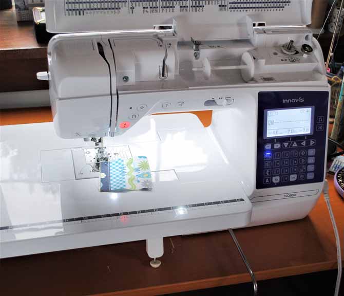The Brother NQ900 sewing machine is set up and ready to sew.