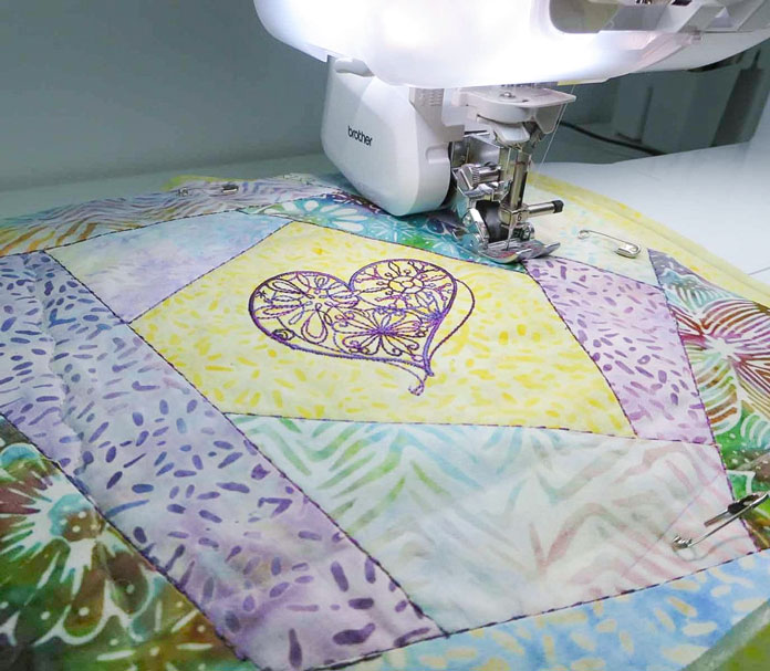 Quilting using the walking foot and serpentine stitch with monofilament thread